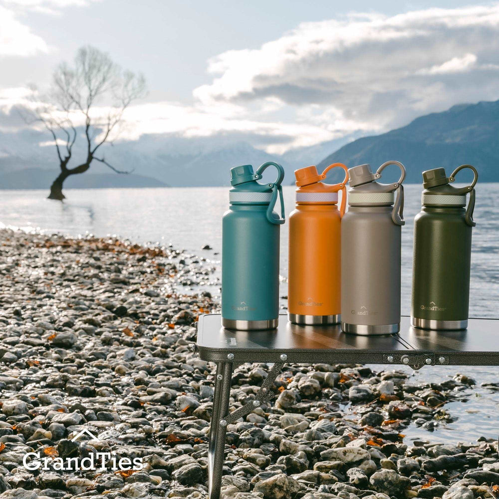 Insulated Travel Water Bottle with Two Stylish Ergonomic Handle Lids 32oz/946ml - Atlantis Blue - Grandties